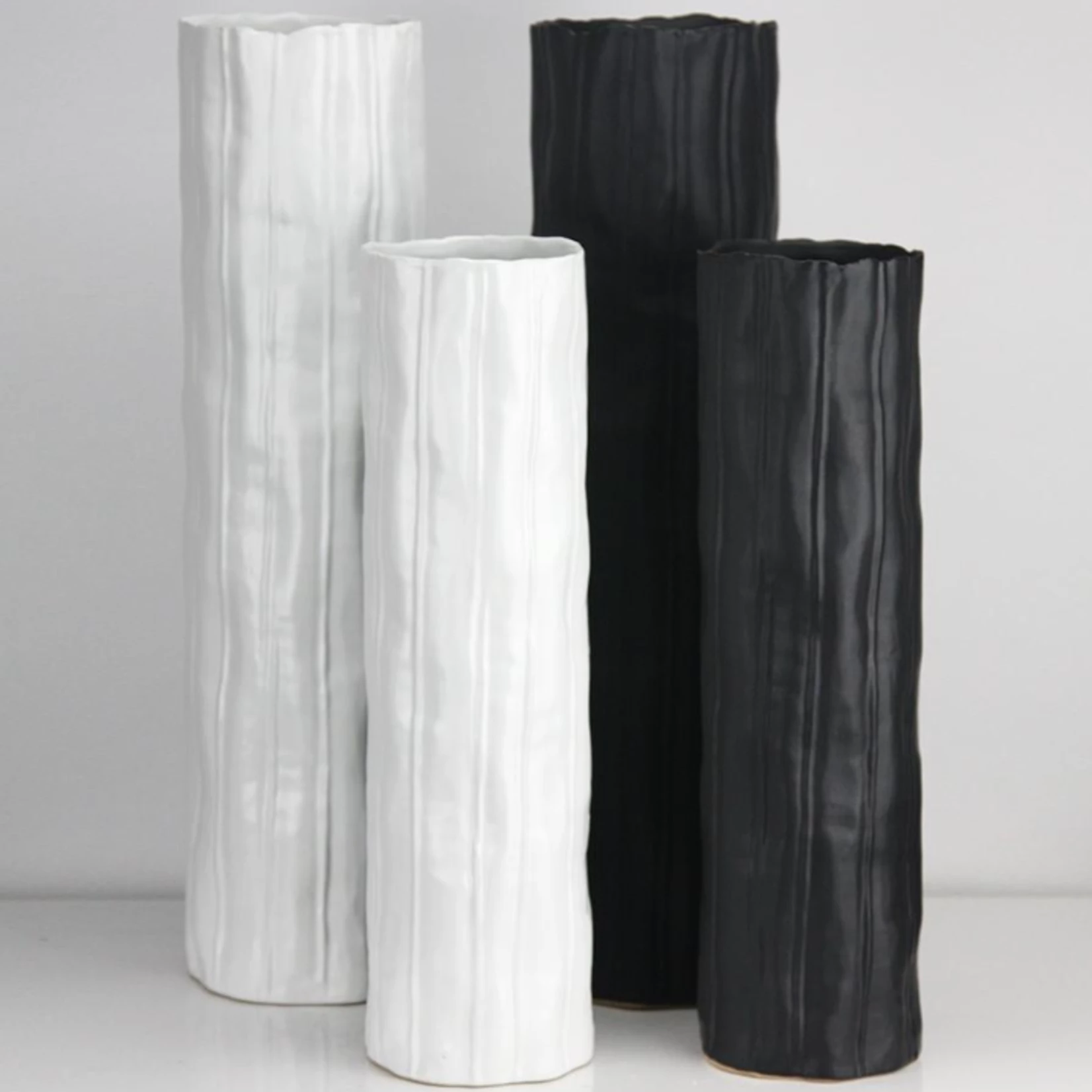 15.5”H X 4.5”D WHITE CERAMIC CAPRICORN TEXTURED CYLINDER 3 15.5”H X 4.5”D WHITE CERAMIC CAPRICORN TEXTURED CYLINDER