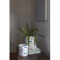 50% Off Was $34 Now $17. 7.5”H X 5.25” WHITE CERAMIC MARLIN POT -Quality Wholesale Shop accent decor 50 off was 34 now 17 75h x 525 white 2